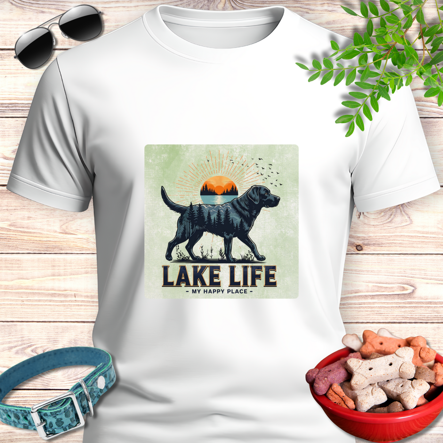 White t-shirt with a graphic of a dog and 'Lake Life My Happy Place' text on a light gray background