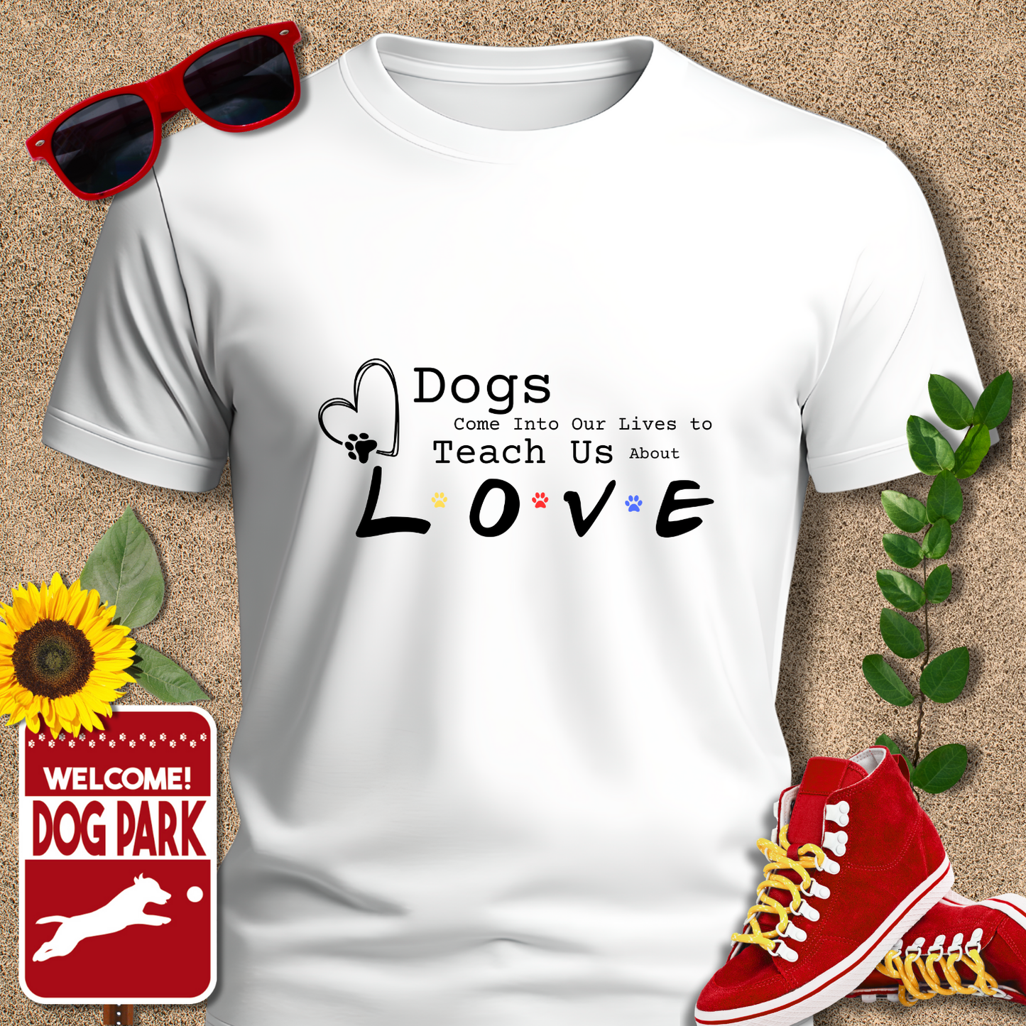 White t-shirt with 'Dogs Come Into Our Lives to Teach Us About Love' text, red sneakers, sunglasses, sunflower, and 'Welcome to the Dog Park' sign on a textured background.