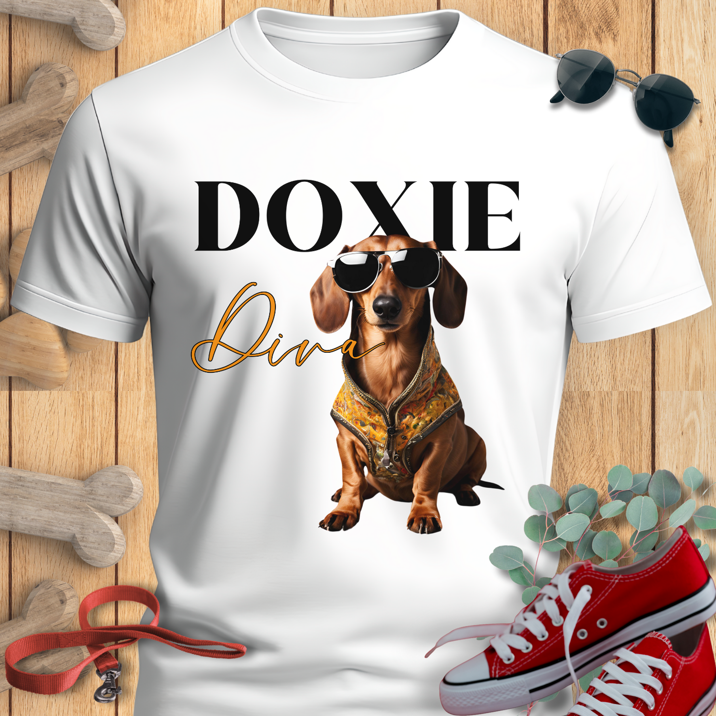 Weeniedog shirts with Doxie Diva Graphic in White and 'Doxie Diva' text on a wooden surface with accessories.
