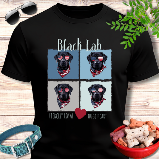 Black t-shirt with black lab design on a wooden surface with accessories.