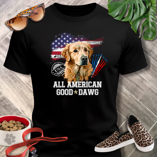 Black t-shirt with a dog graphic and text, surrounded by sunglasses, shoes, and pet food.