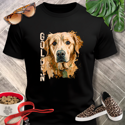 Black t-shirt with a golden retriever graphic, surrounded by pet accessories on a wooden surface.