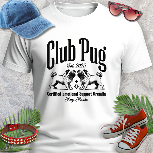 White t-shirt with 'Club Pug' design, blue cap, red sneakers, sunglasses, and green leaves on a textured surface.