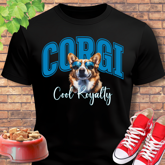 Black t-shirt with a corgi graphic and text, red sneakers, and a bowl of dog food on a brick background.