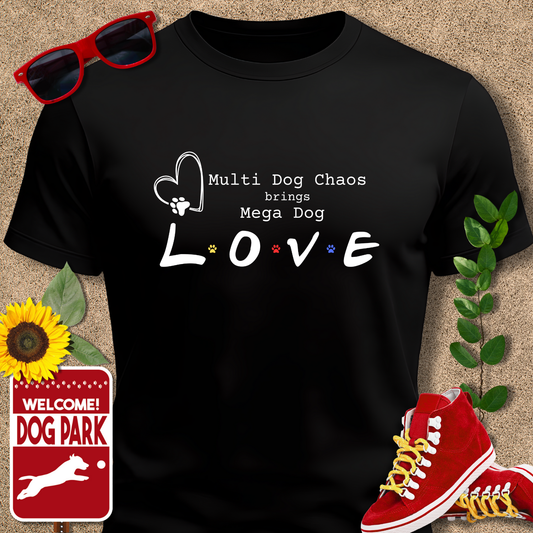 Black t-shirt with 'Multi Dog Chaos brings Mega Dog LOVE' text, sunglasses, red sneakers, sunflower, and 'Welcome to the Dog Park' sign on a beige background.