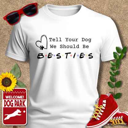 White t-shirt with 'Tell Your Dog We Should Be Besties' text, red sneakers, sunglasses, sunflower, and 'Welcome to the Dog Park' sign on a textured background.