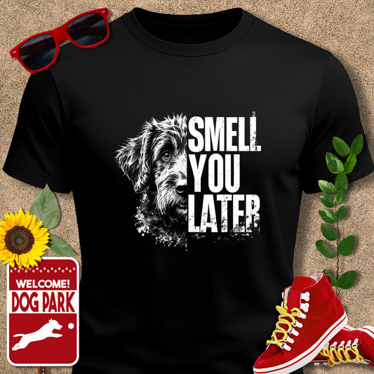 Crazy Dog T Shirts, "Smell You Later" in Black' on a beige background with sunglasses, sunflower, and red sneakers.