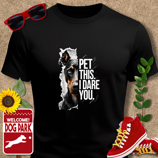 Crazydog t shirt in Black with dog graphic and text 'Pet this. I dare you.' on a textured surface with sunglasses, sneakers, and a sign.