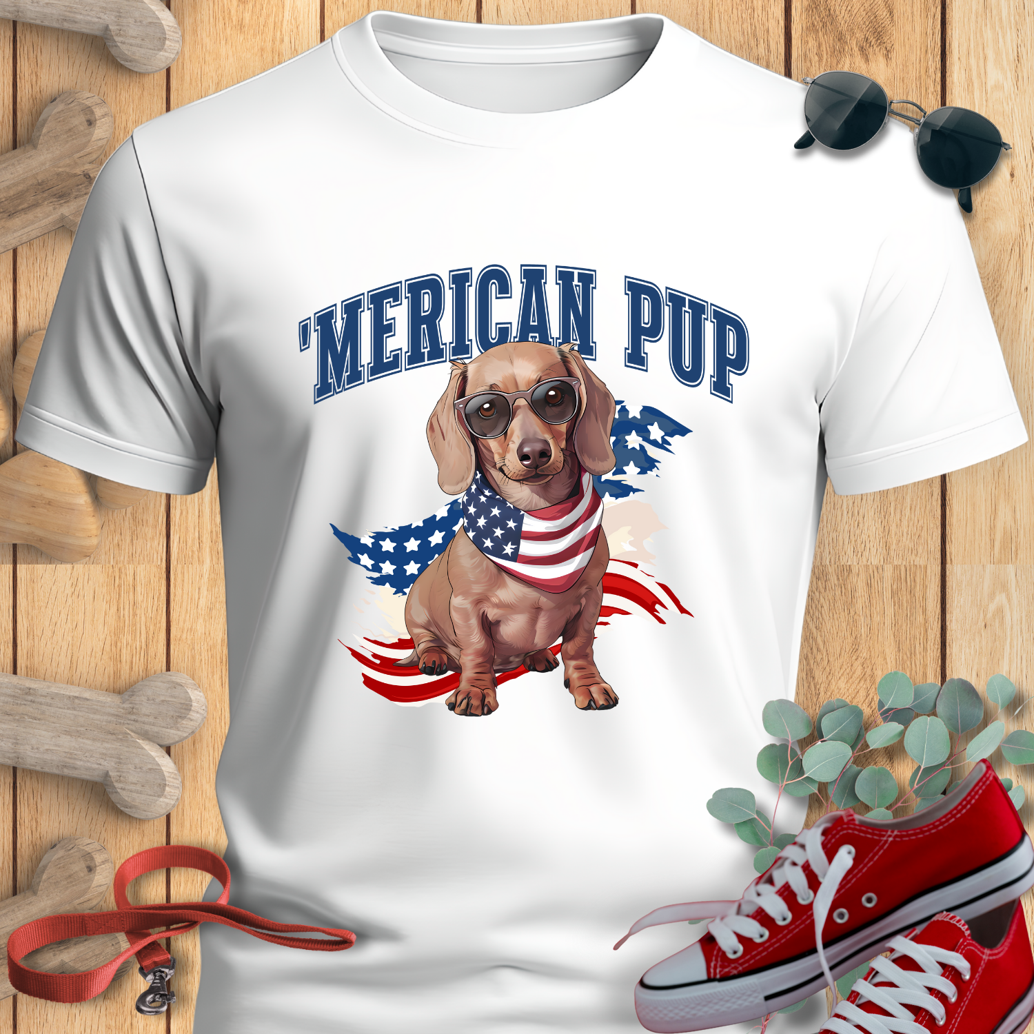 Dachshund shirt with 'Merican Pup in White featuring a dachshund, sunglasses, red sneakers, and a wooden background.
