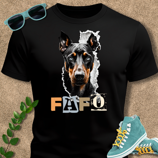 Black t-shirt with a dog graphic and 'FAFO' text, paired with sunglasses and sneakers on a beige background.