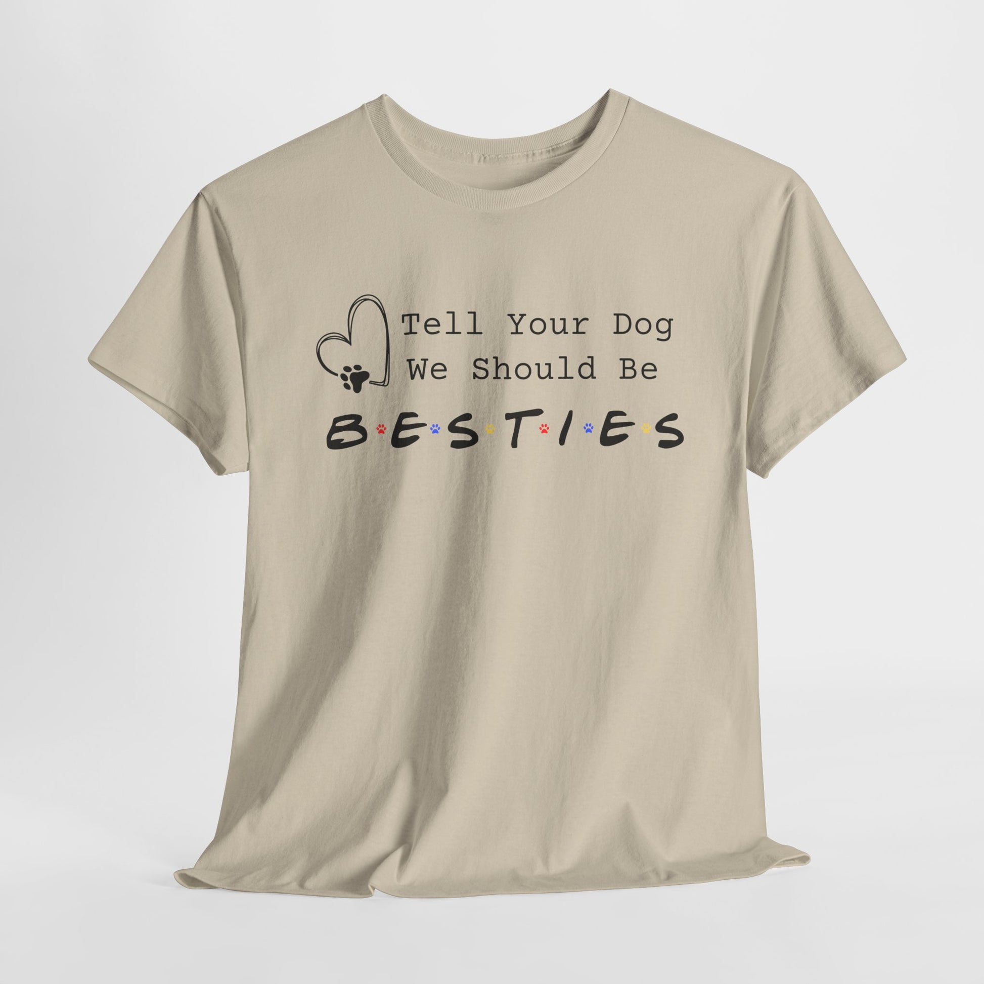 Sand t-shirt with 'Tell Your Dog We Should Be Besties' text on a white background