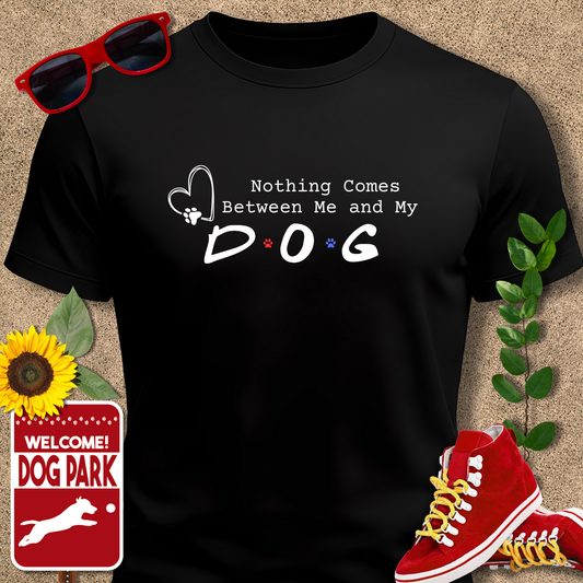 Black t-shirt with 'Nothing Comes Between Me and My Dog' text, sunglasses, red sneakers, sunflower, and 'Welcome to the Dog Park' sign on a beige background.