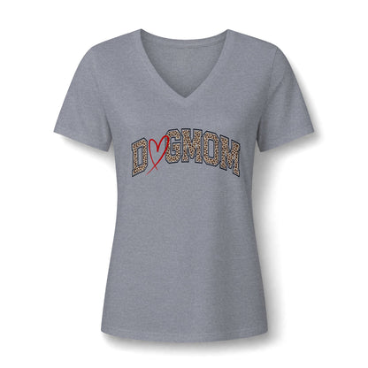 A women's heather gray V-neck t-shirt with a 'DOG MOM' graphic across the chest. The letters are filled with a leopard print pattern and a red heart outline is drawn through them, set against a plain grey background.