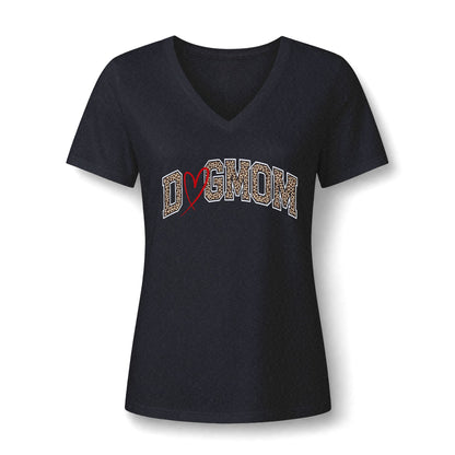 A women's short-sleeve V-neck t-shirt in dark navy blue, featuring a graphic across the chest that reads 'DOGMOM' in a textured beige pattern with a red heart.