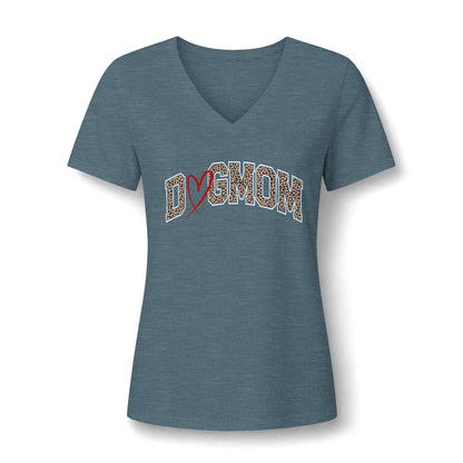 A women's short-sleeve V-neck t-shirt in heather slate blue, featuring a graphic on the chest that reads 'Dogmom' in leopard-print letters with a red ribbon heart.